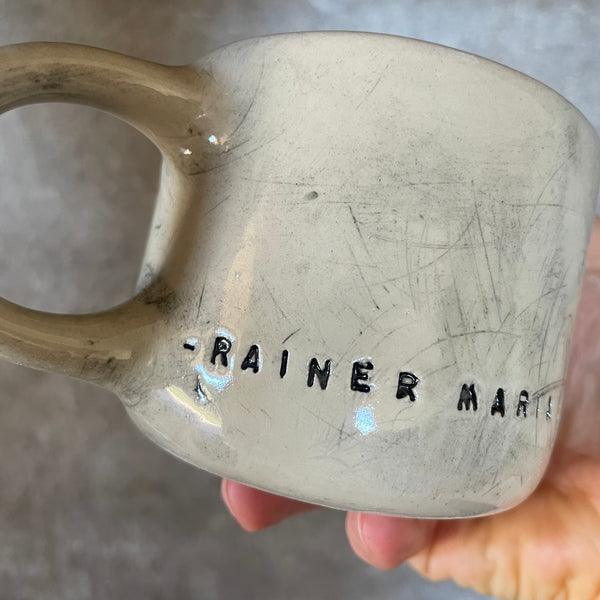 Ceramic mug with artist quote