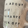 Ceramic mug with saying about balance with handle