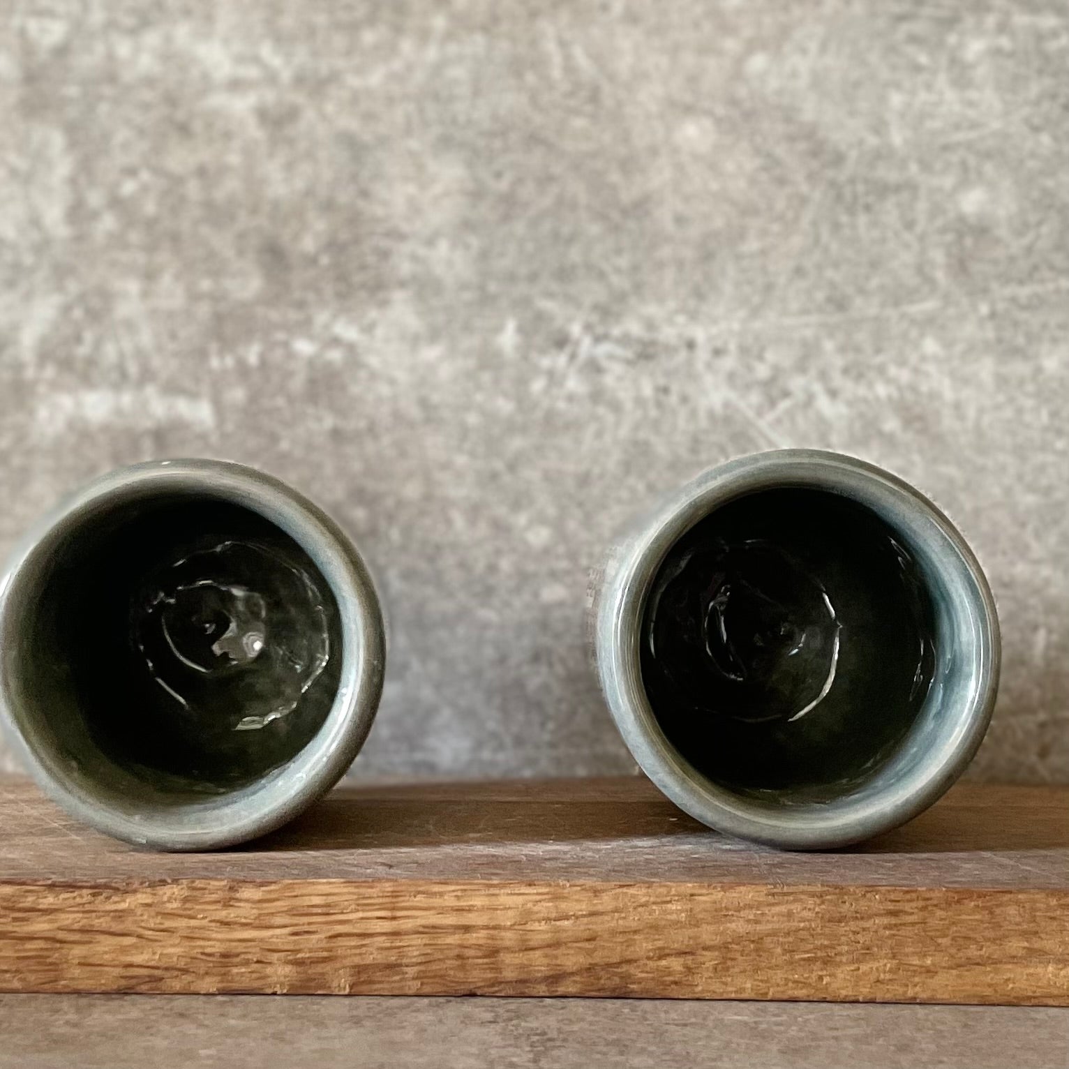 Set of small grayish mugs