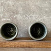 Set of small grayish mugs