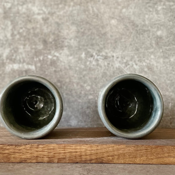Set of small grayish mugs