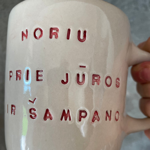 Pink mug with saying in Lithuanian
