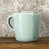 Small blue mug with words in Lithuanian