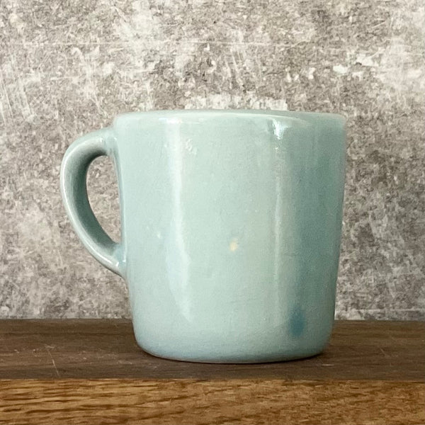 Small blue mug with words in Lithuanian