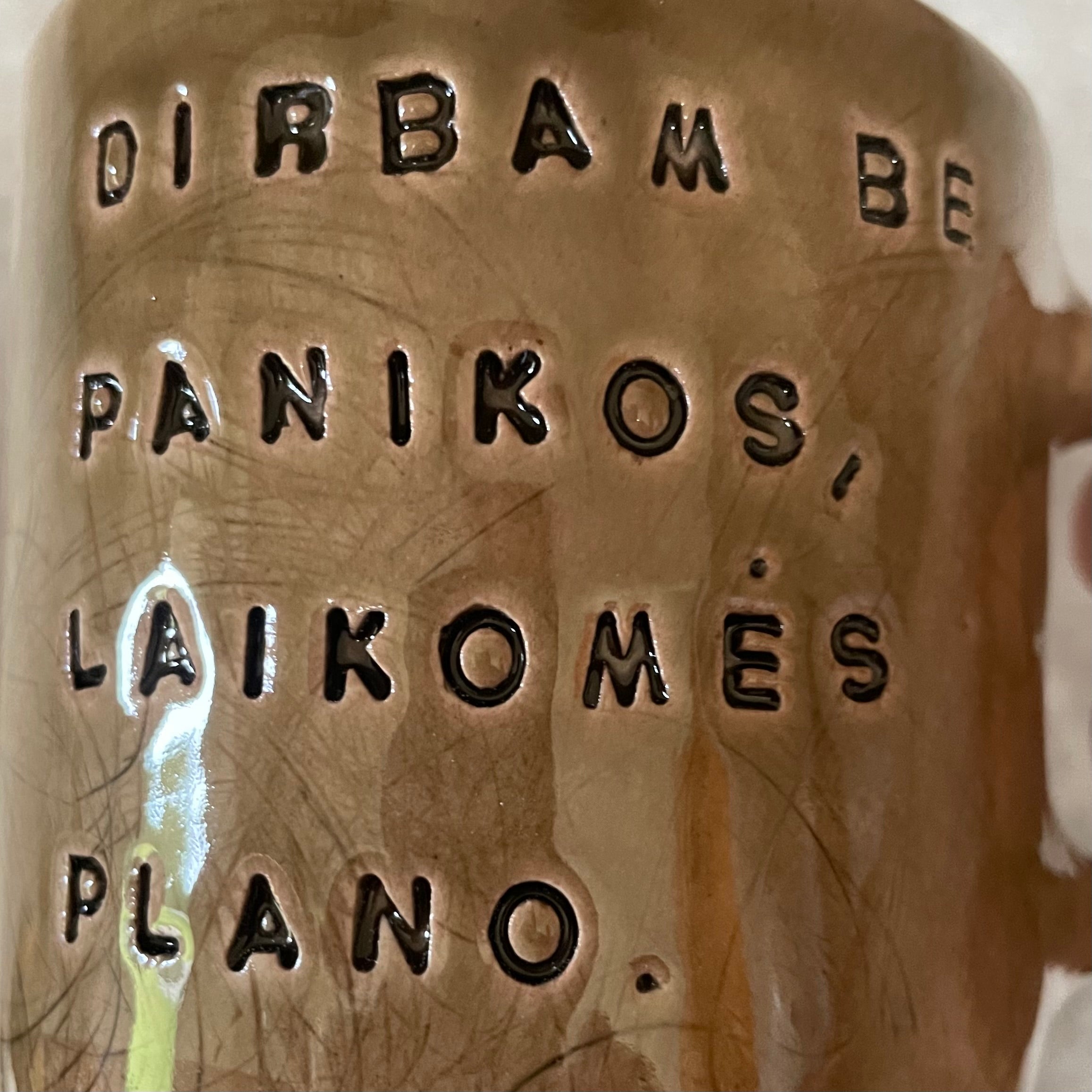 Dark brown tumbler mug with words about work