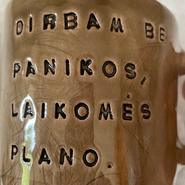 Dark brown tumbler mug with words about work