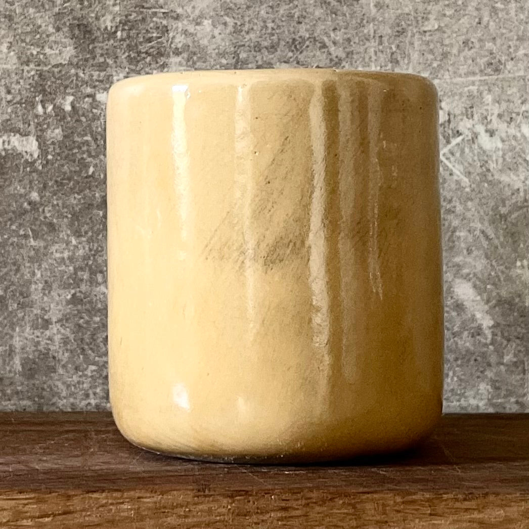 Yellow tumbler mug with word in Lithuanian POILSIS