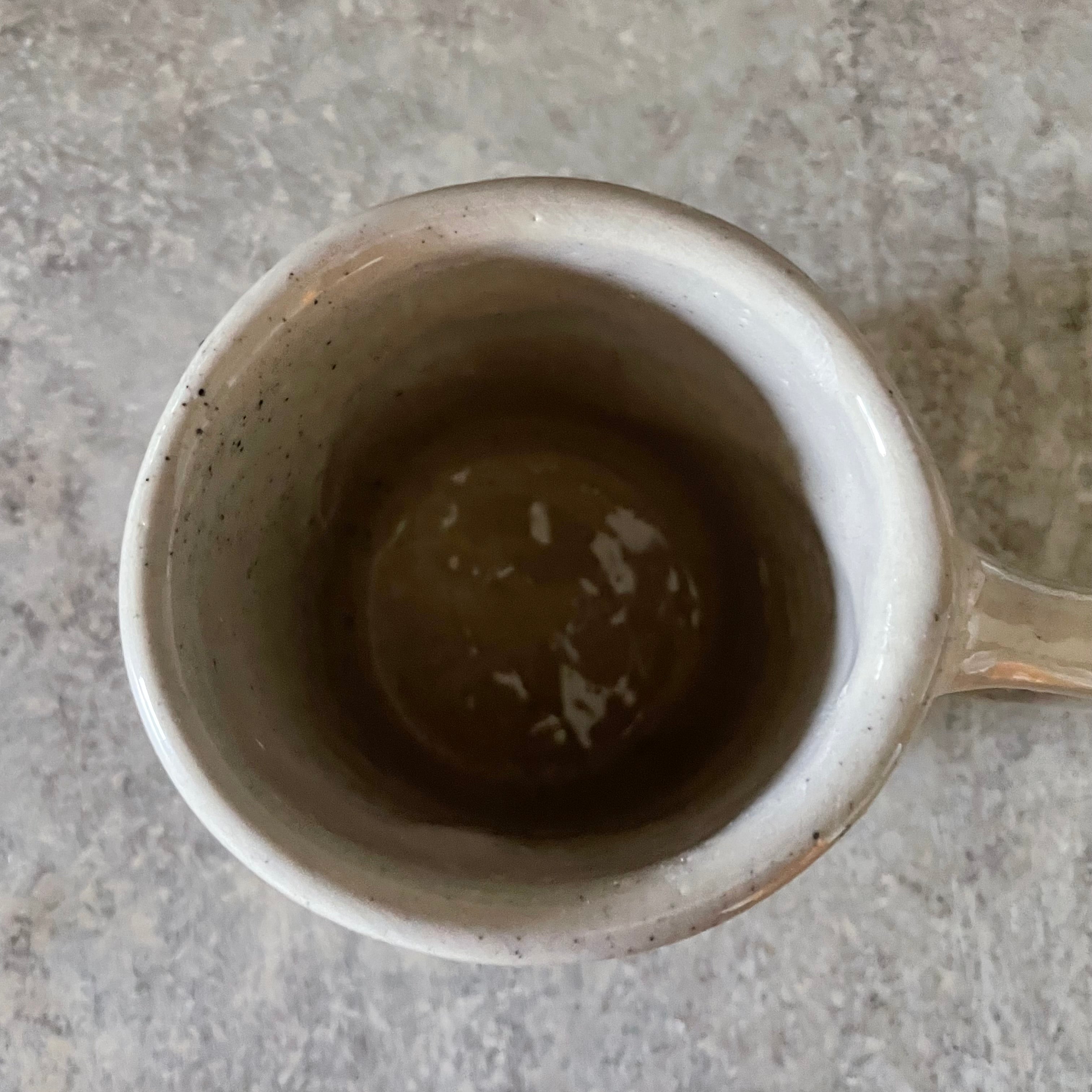 Speckled mug with words about work - another