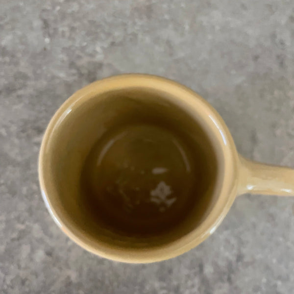 Yellow ceramic mug about luck