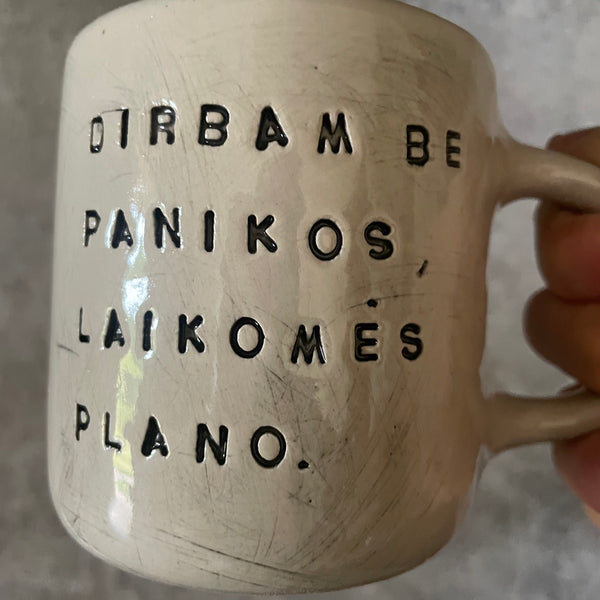 White medium ceramic mug with words about work