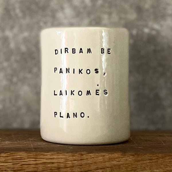 White mug without handle with saying about work