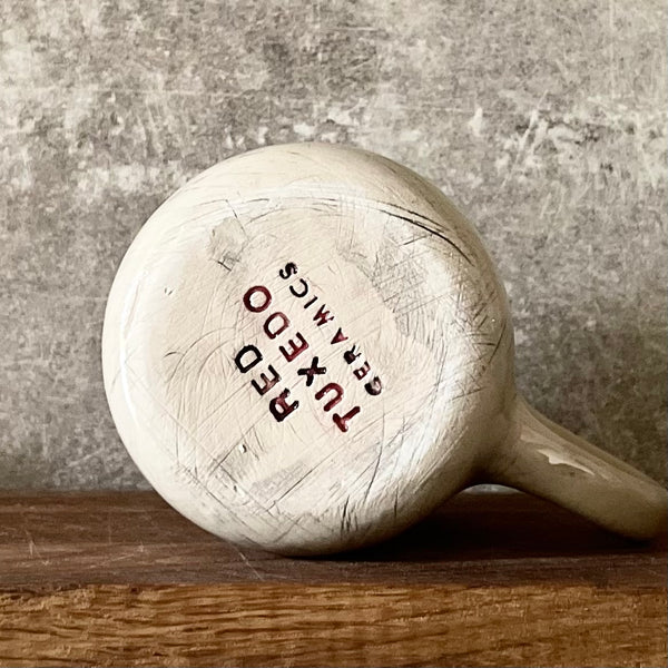 White medium ceramic mug with words about work