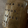 Dark brown tumbler mug with words about work