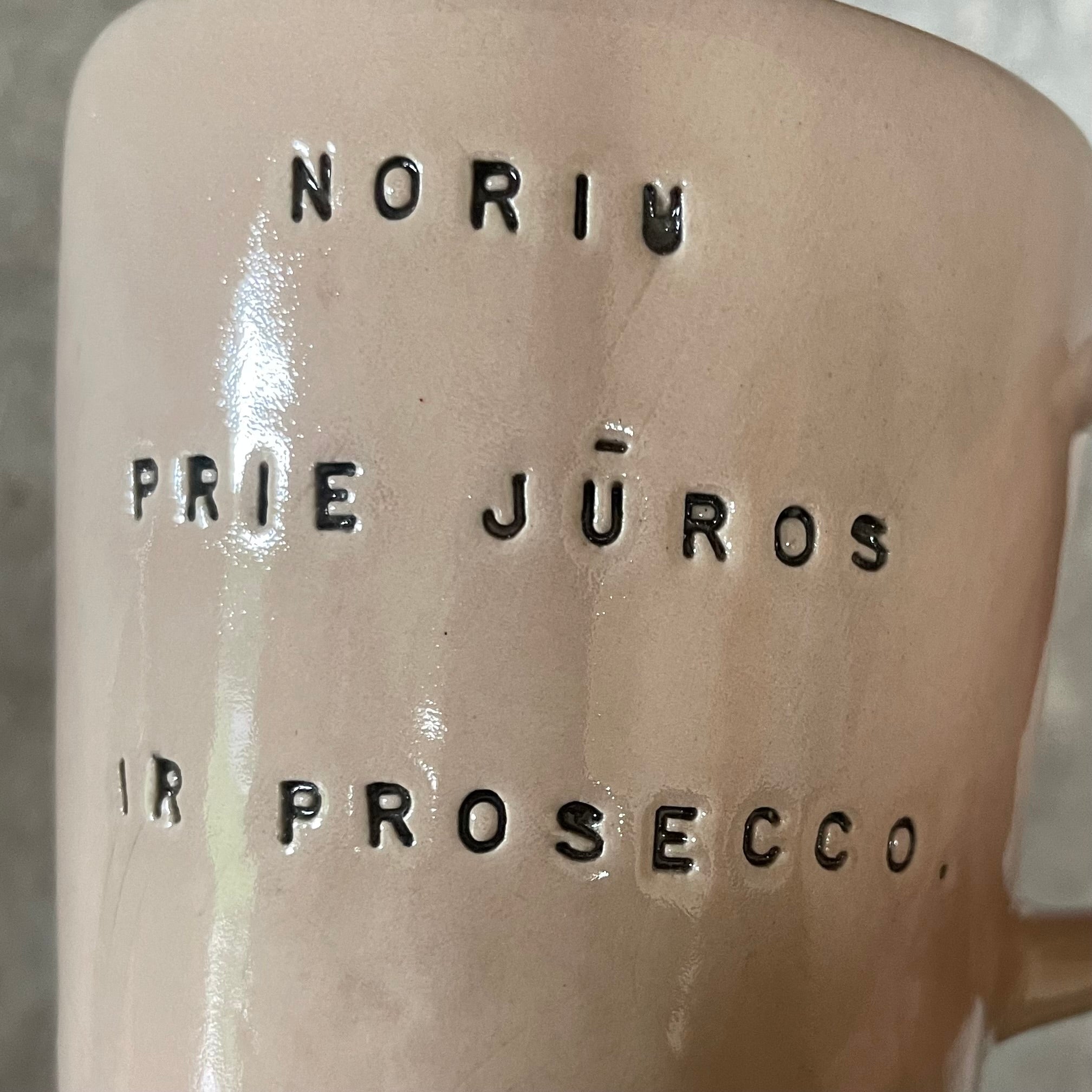 Pale pink mug with prosecco saying