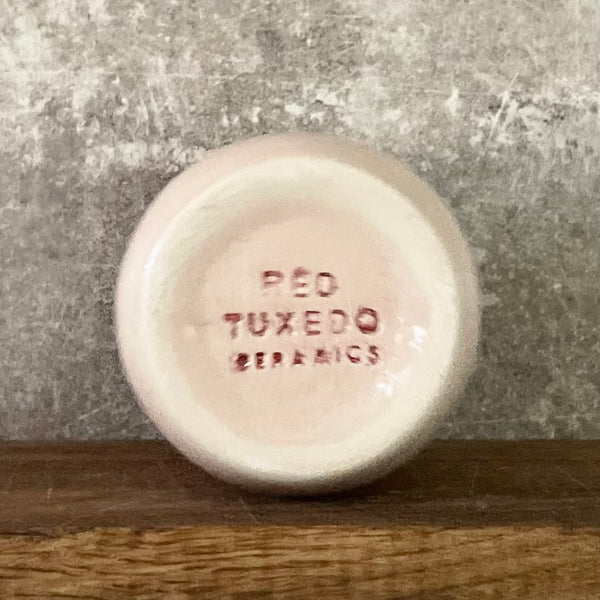 Large pink tumbler mug with text in Lithuanian