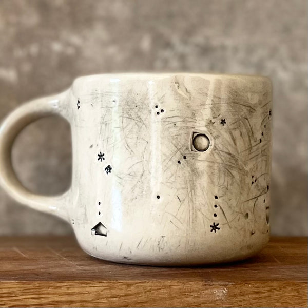 Ceramic mug with saying about magic