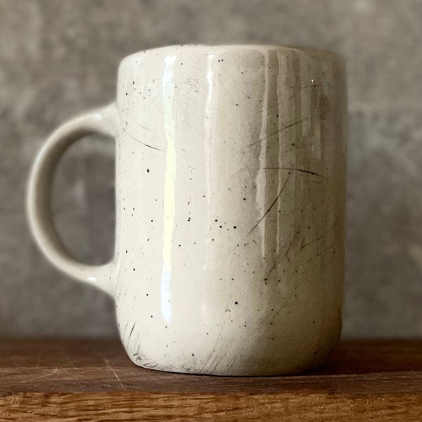 Speckled mug with funny phrase in Lithuanian