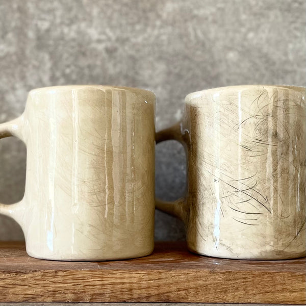 A pair of big ceramic mugs for work and home