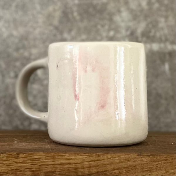 Pale pink ceramic mug with word LĖTAI