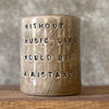 Brown mug with Nietzsche quote