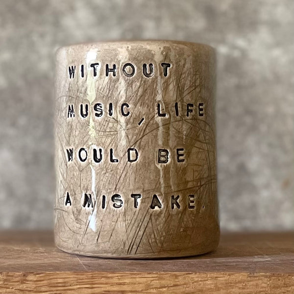 Brown mug with Nietzsche quote
