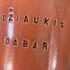 A pair of mugs with words in Lithuanian