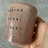 Pink mug with calming words without handle