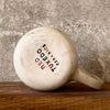 Ceramic mug with saying about magic