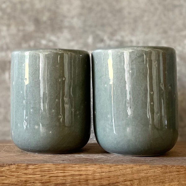 Set of small grayish mugs