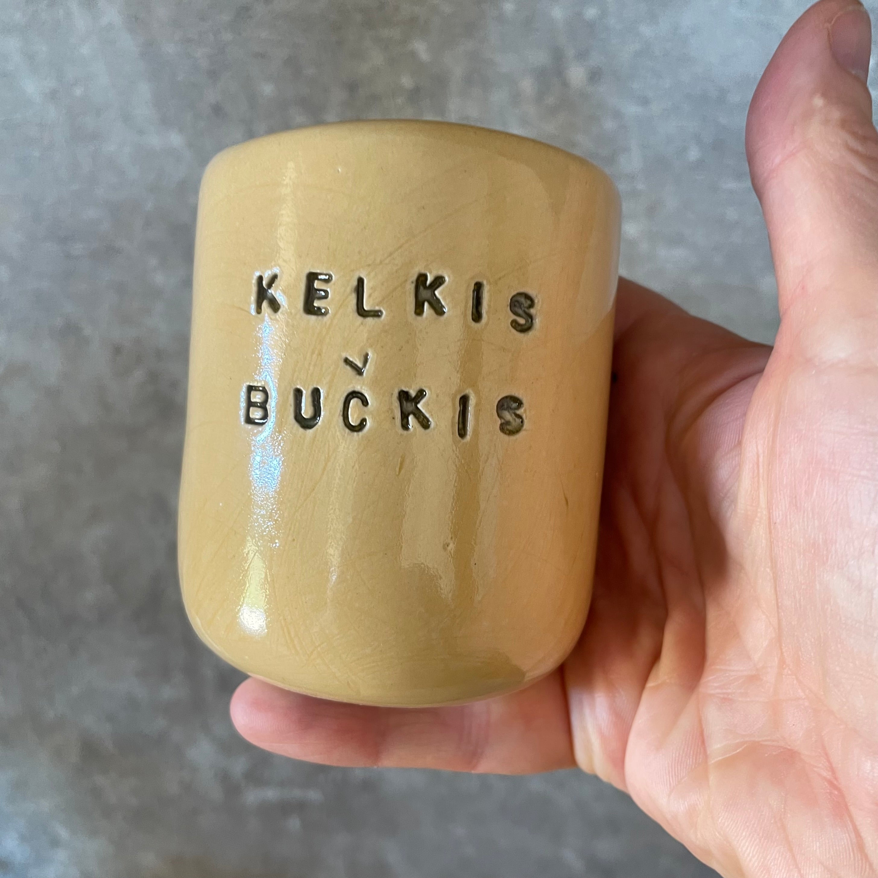 Geltonas puodelis KELKIS BUČKIS