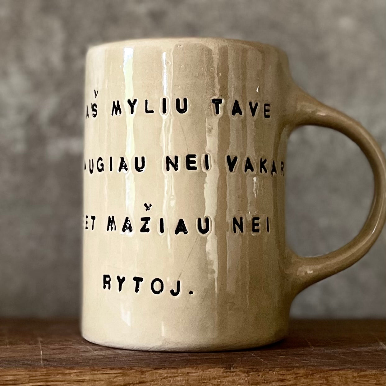 Beige mug with love saying in Lithuanian