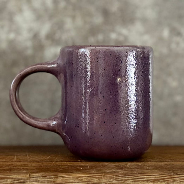 Small purple mug with words in Lithuanian