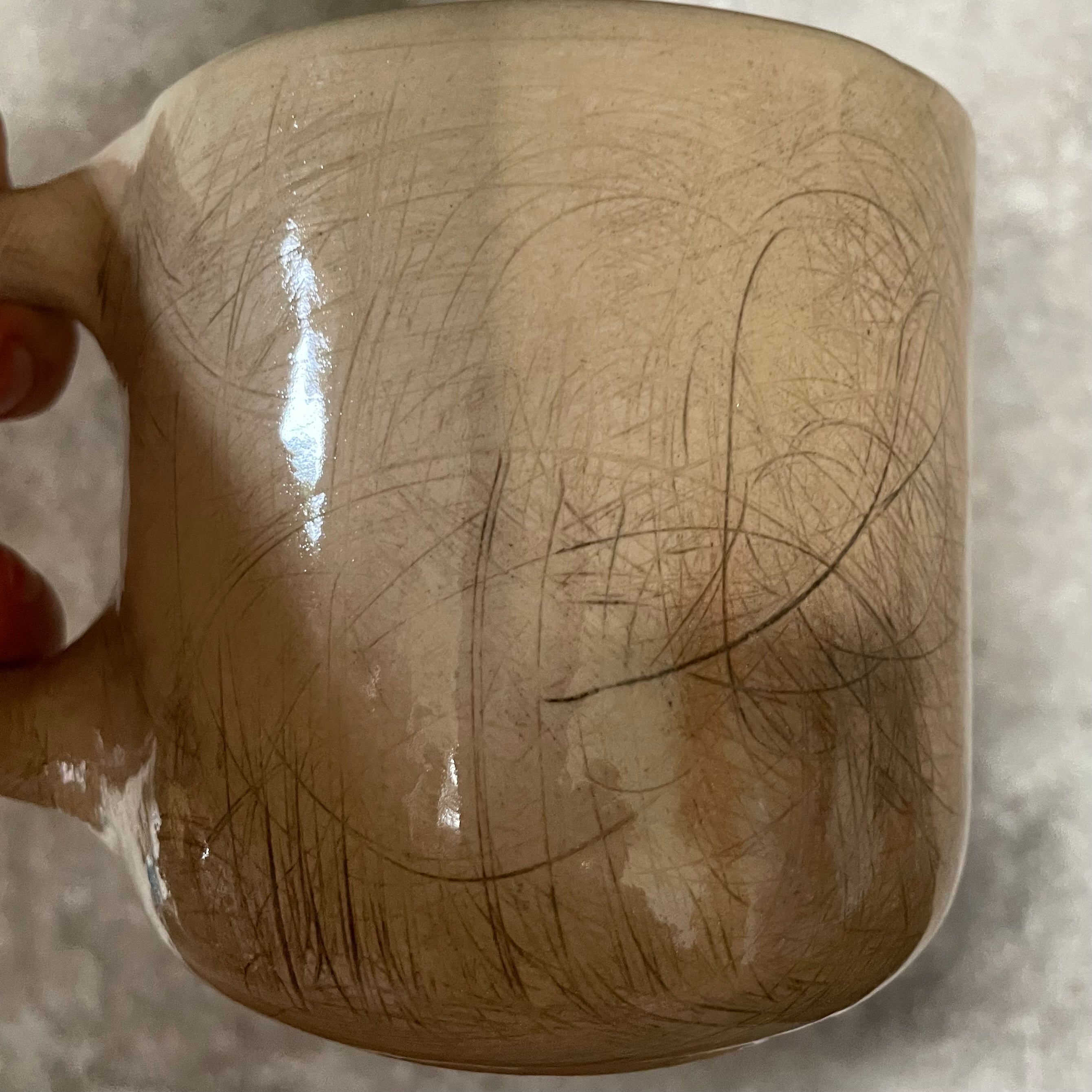 Big beige mug with saying in Lithuanian