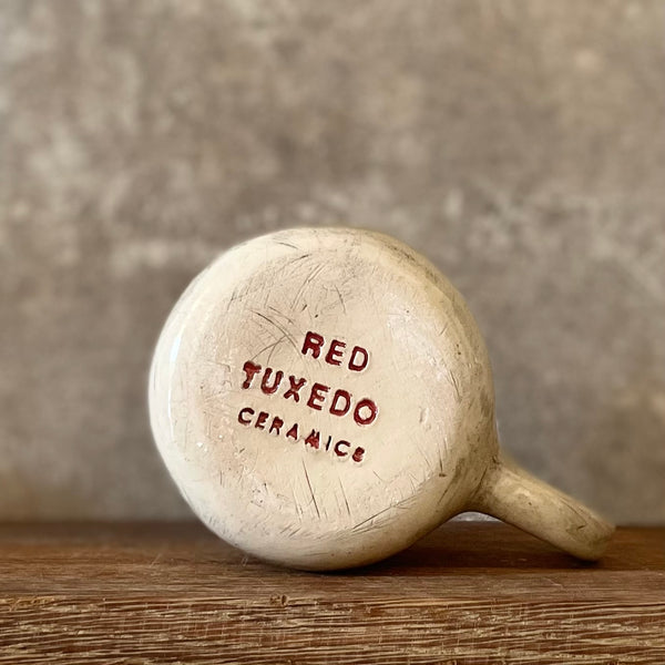 Ceramic mug with artist quote