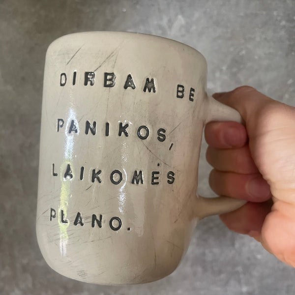 Two big ceramic mugs with words about work