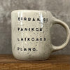 Speckled mug with words about work