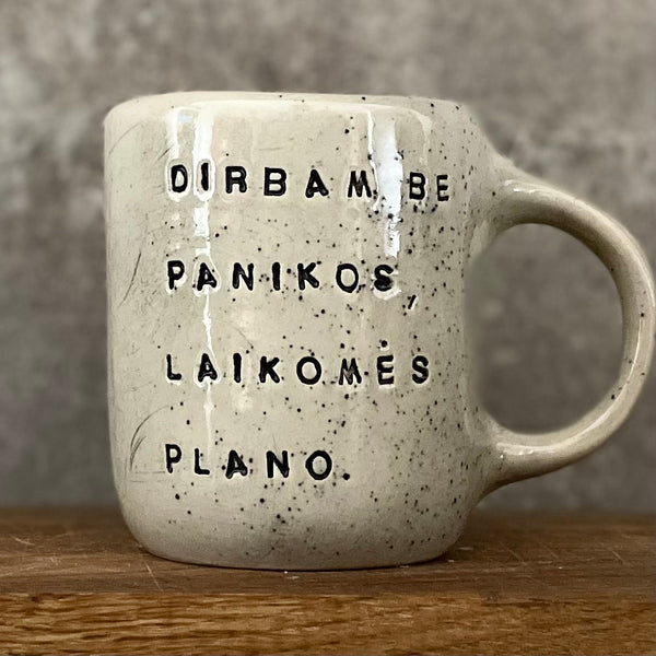 Speckled mug with words about work