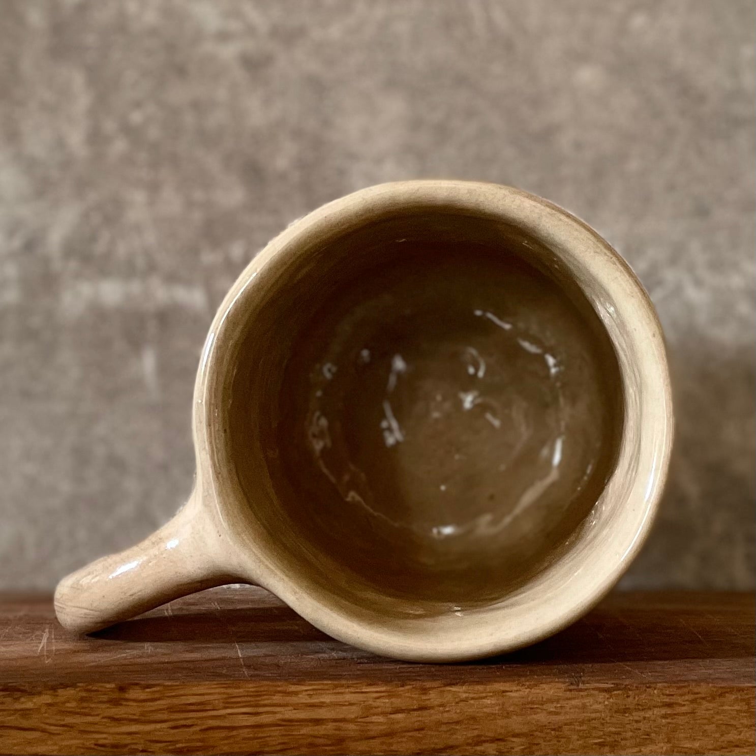 Big beige mug with saying in Lithuanian