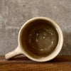 Big beige mug with saying in Lithuanian