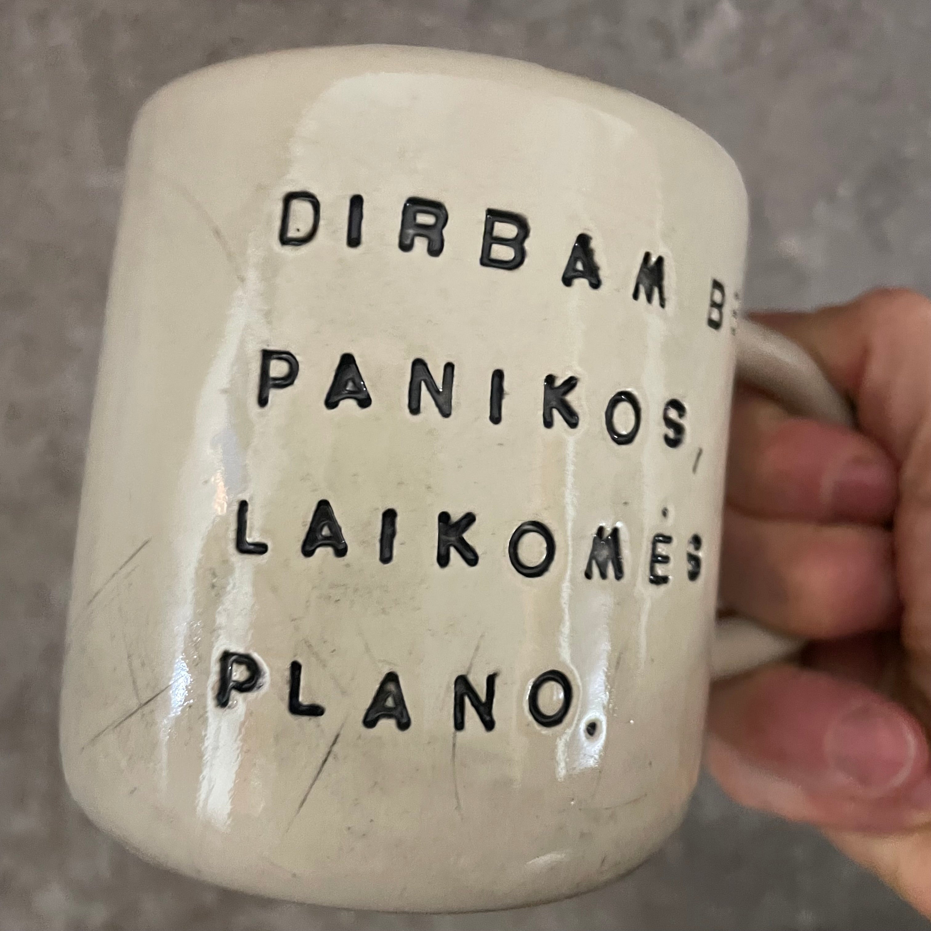 White medium ceramic mug with words about work