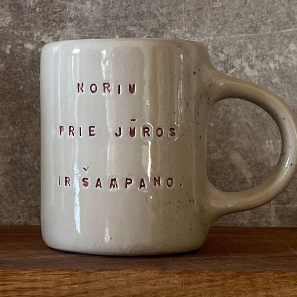 Speckled mug about champagne and the sea