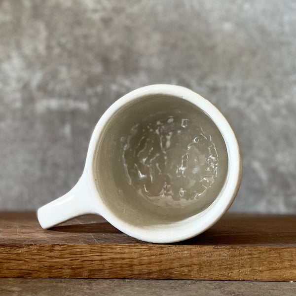 Mug with quote about artists