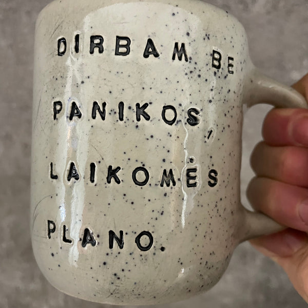 Speckled mug with words about work
