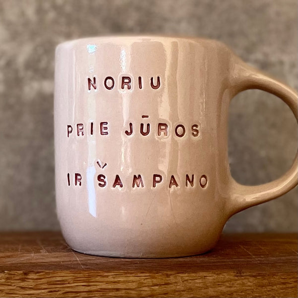 Pink big mug with saying in Lithuanian