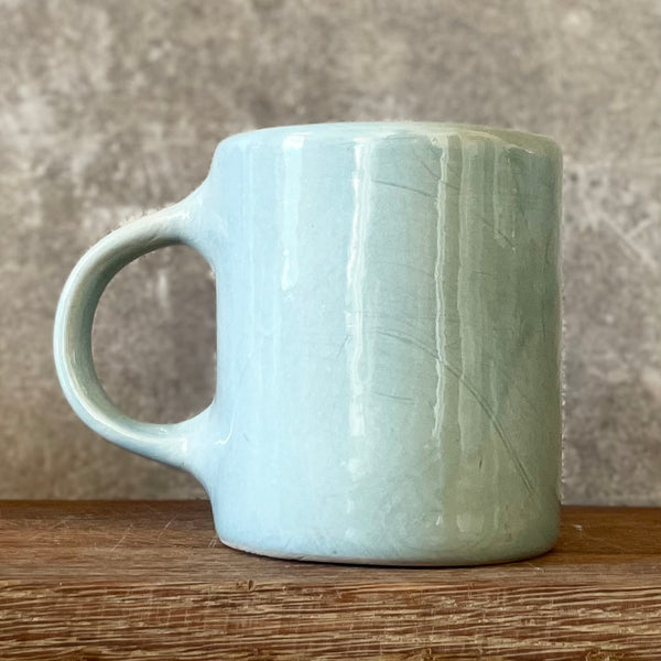 Blue mug with funny phrase in Lithuanian