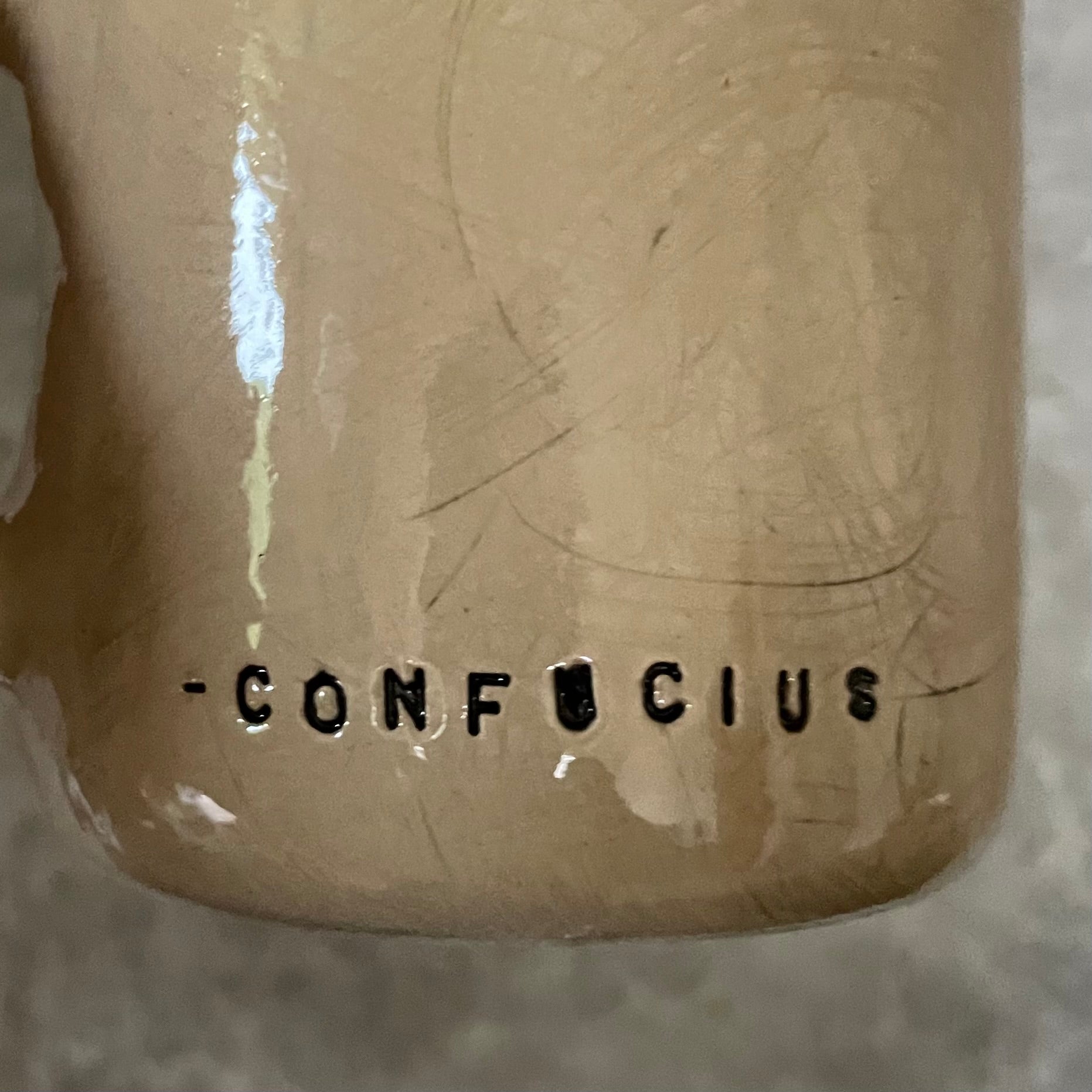 Beige mug with quote by Confucius