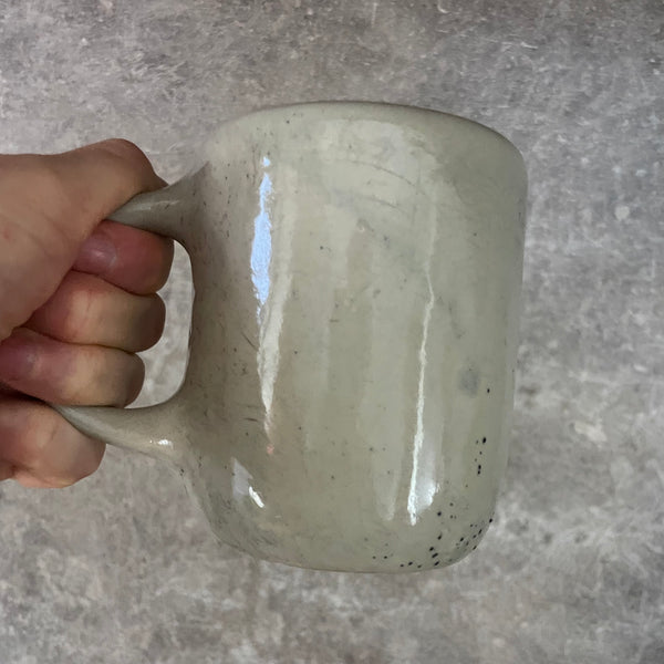 Speckled coffee mug with funny saying in Lithuanian