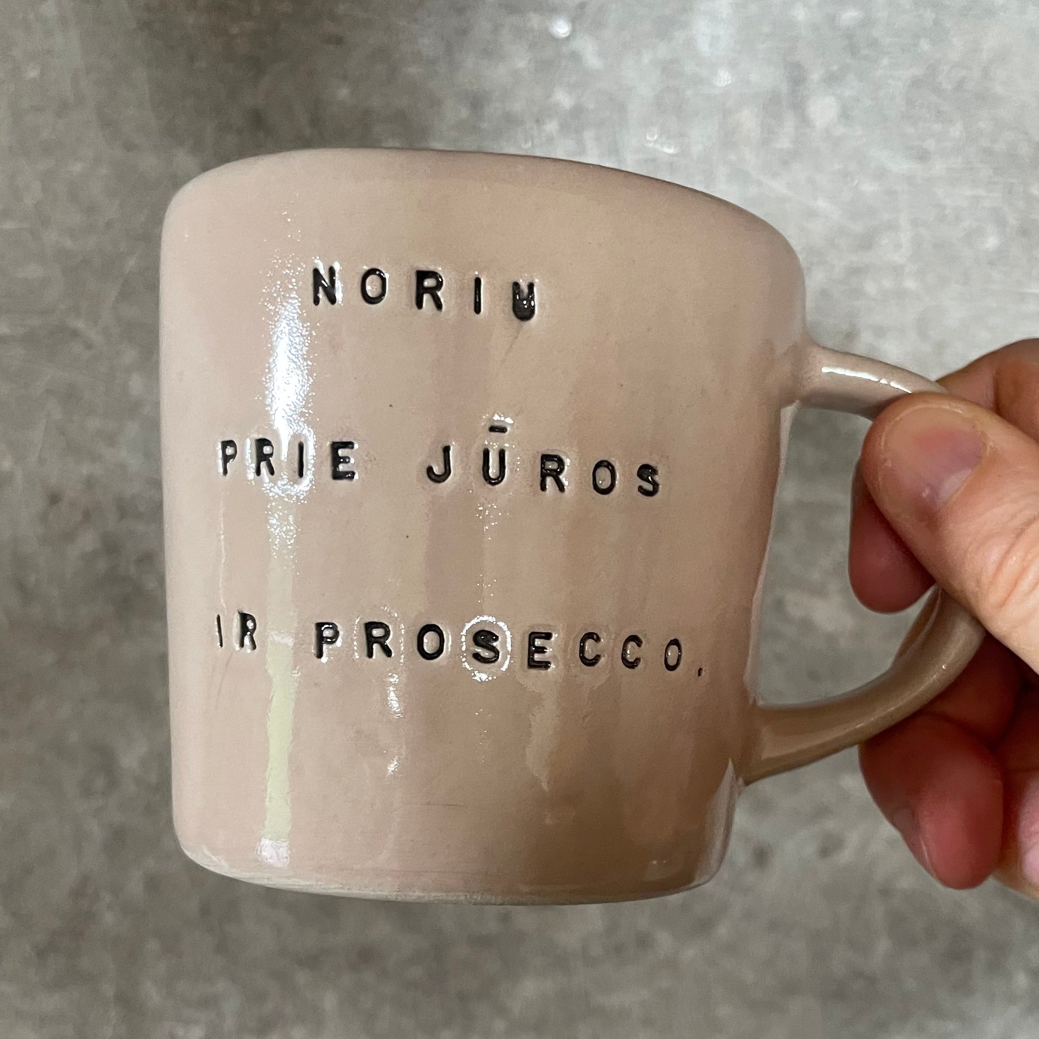 Pale pink mug with prosecco saying