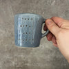 Small blue mug with magic words