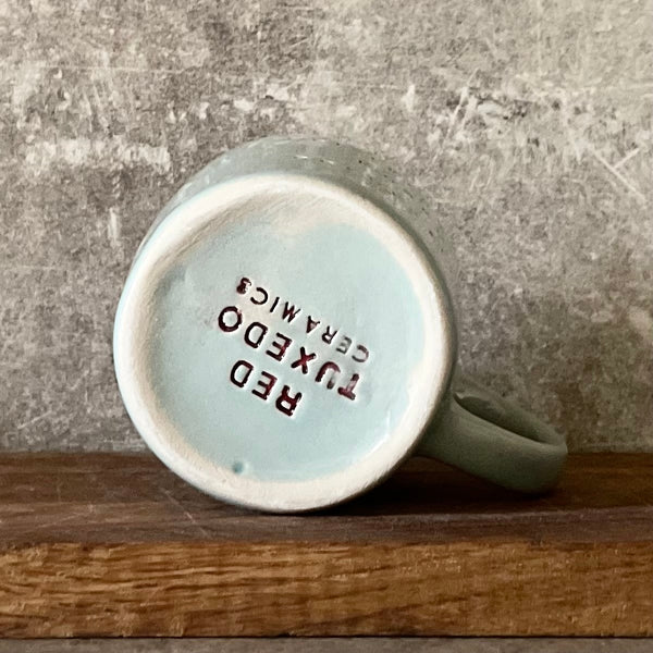 Blue mug with saying in Lithuanian